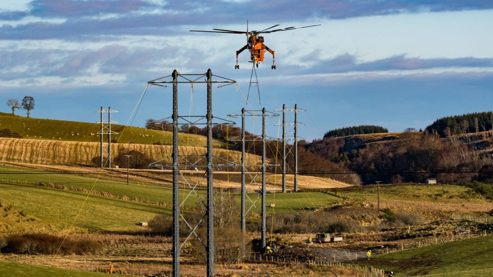 Helicopter used to install composite power poles